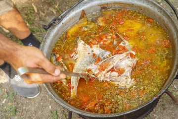 Traditional fish soup (Carp soup) localy made by villagers and fishermans in the Danube Delta, Romania