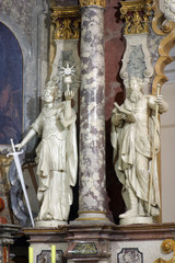 Fototapeta premium Saints Barbara and Joachim statue on the main altar in the Franciscan church of St. Francis Xavier in Zagreb, Croatia