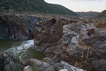 Pulo do Lobo waterfall with river guadiana and rock details at sunset in Mertola Alentejo, Portugal