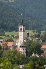 Obraz premium Škofja Loka. View over the city in Slovenia. Historical city. Cityscape with church in focus. Šentjakobska cerkev or Šentjakob`s church tower.