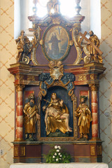 Fototapeta na wymiar The altar of Our Lady of Sorrows in the church of Saint Barbara in Vrapče, Zagreb, Croatia