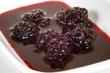 Close up view of a blackberry jam in the plate