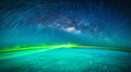 Landscape with Milky way galaxy. Earth and Aurora view from space with Milky way galaxy. (Elements of this image furnished by NASA) © nuttawutnuy