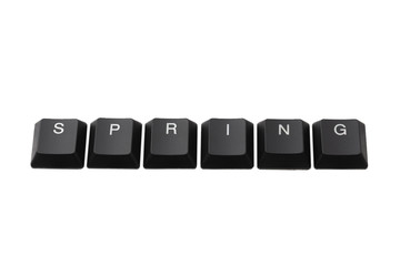Word spring written on keyboard. Isolated on white.