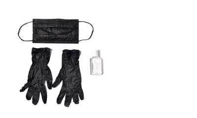 Black protective gloves, black protective mask and antiseptic gel on a white background. Concept of hygiene and protection against coronavirus