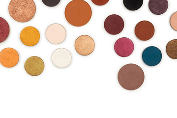 Round multicolored make up eyeshadows isolated on white.