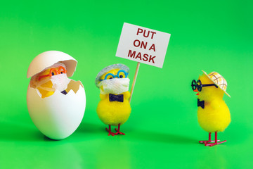 Masked chickens with a sign put on a mask. Coronavirus protection concept covid-19