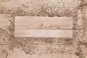 wood shavings on a wooden background from oak planks with expressive texture and natural pattern