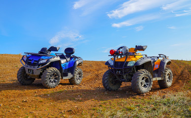 Two   atv quad motorbikes standing on the top of mountain. sunny weather. leisure tourism hobby concept. outdoor adventures © TetiSof
