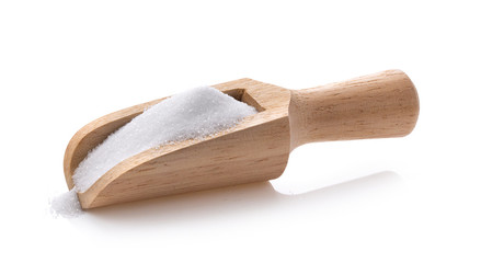 salt in wood scoop  isolated on white background