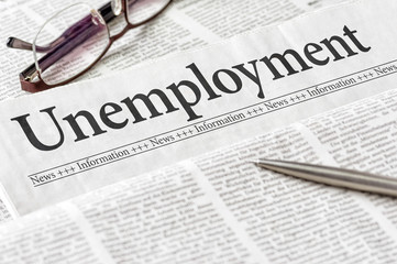 A newspaper with the headline Unemployment