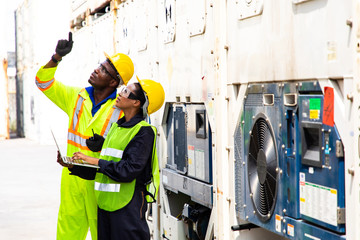 technician engineer staff monitoring the temperature container box by using laptop computer at...