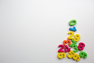 colorful plastic toys on white background