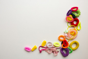 Fototapeta na wymiar Multi-colored rubber bands on a white background