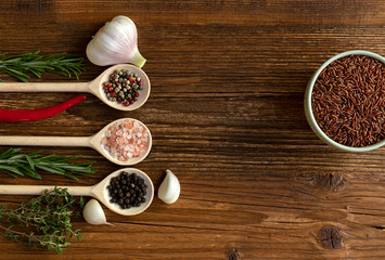 Top view of old wooden kitchen table with ingredients