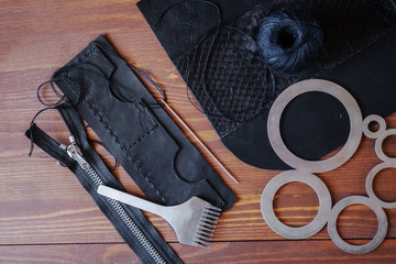 Genuine Leather. Sewing a purse. Leather work. Tools for sewing bags, wallets, clutches. Stitching....