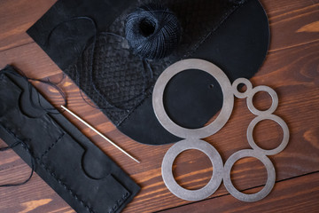 Genuine Leather. Sewing a purse. Leather work. Tools for sewing bags, wallets, clutches. Stitching....