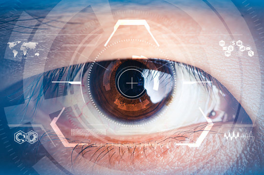 The double exposure image of the businessman looking up during sunrise overlay with cityscape image and futuristic hologram. The concept of modern life, technology, iris scanner and internet of things