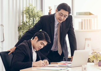Executive boss advice young staff about business plan