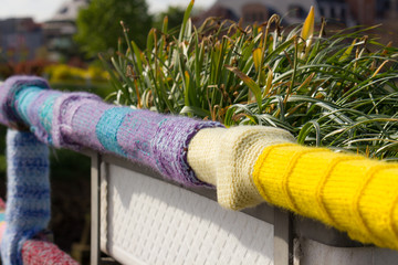 Bridge railing covered with colorful knitted wool (Duffel, Belgium)