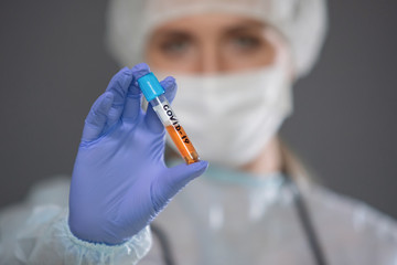 Nurse hold test tube for coronavirus.