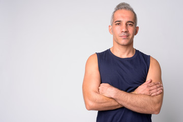 Portrait of handsome Persian man with arms crossed