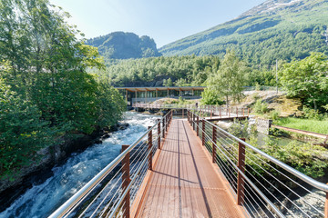 GEIRANGER, NORWAY - 2016 JUNE 14. Walking on the platform by the Storfossen waterfall at Geiranger...