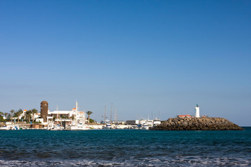 Naklejka premium Marina with lighthouse in Caleta de Fuste, Fuerteventura, Canary Islands, Spain, Europe