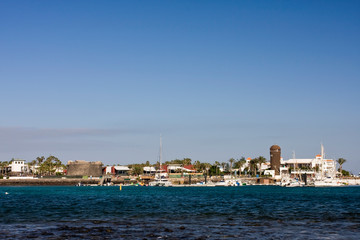 Fototapeta premium Marina with lighthouse in Caleta de Fuste, Fuerteventura, Canary Islands, Spain, Europe