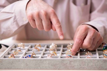 Old male jeweler at workshop