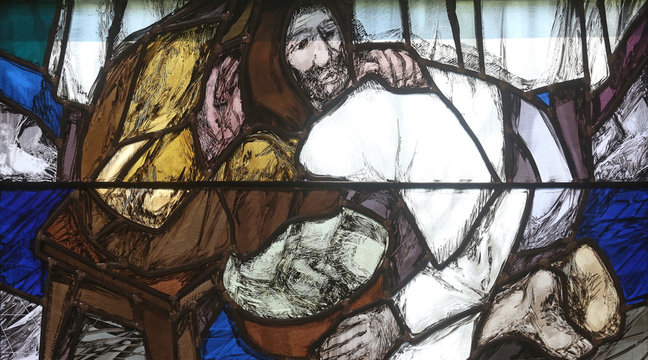 God begins salvation in this world through His Son Jesus Christ, detail of stained glass window by Sieger Koder in St. John church in Piflas, Germany