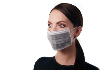 Young woman in medical mask on face, healthcare corona virus covid 19 pneumonia pandemic protective lifestyle concept. Patient health safety equipment hospital equipment uniform.