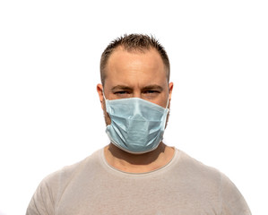 Man wearing mask and looking to camera on white background. Coronavirus concept. Health care and medical.