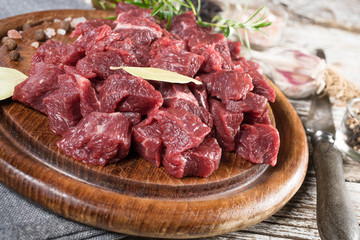Beef stew prepared on a chopping board.