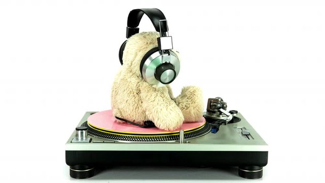 Teddy bear DJ rotating on vintage record player