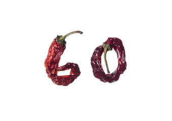 Red dried pods of pepper on a white background. High resolution."GO" word made of peppers .