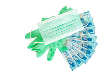 medical mask, medical gloves and money bills of two thousand rubles in a fan on an isolated white background