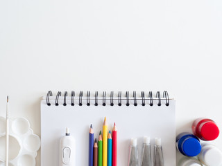 Back to school concept and artist kid concept with Drawing book, crayons, coloured pencils, Poster...