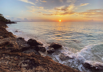 Romantic beautiful sunset, sunrise. Picturesque sea landscape with a rocky shore
