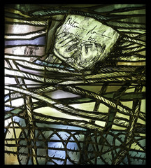 Simon of Cyrene carries the cross,  detail of stained glass window by Sieger Koder in Chapel in the Jesuit cemetery in Pullach, Germany