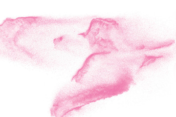 Pink colored sand splash against  white background.