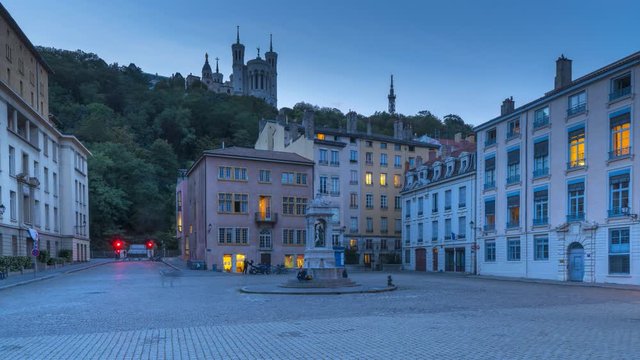 View of La Basilique Notre Dame de Fourvi&egrave;re at night in Lyon city from Place Saint Jean Hyperlpase video france lyon at night square.