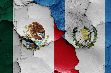 flags of Mexico and Guatemala painted on cracked wall