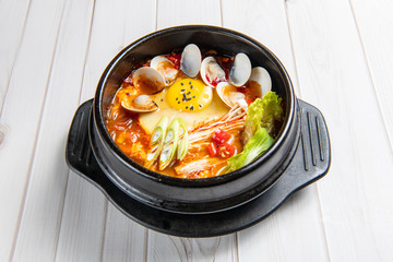 Kimchi jjigae or kimchi stew is a Korean dish, made with kimchi and other ingredients, such as scallions,