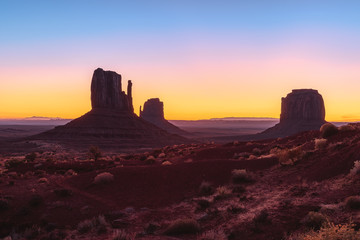 Beautiful colorful sunrise view of famous Buttes of Monument Valley on the border between Arizona and Utah, USA