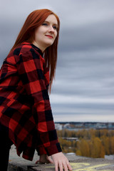 red hair woman in checkered red skirt