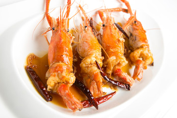 fired giant freshwater prawn with tamarine sauce on with plate closeup shot