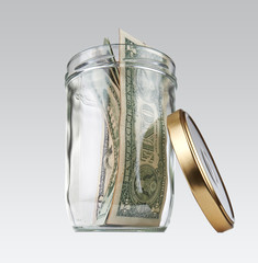Glass jar with some us bill. Concept for the no cash in store