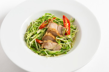 stir fried sunflower seedling with crispy pork 