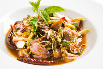 thai herb spicy clams salad serve in white plate